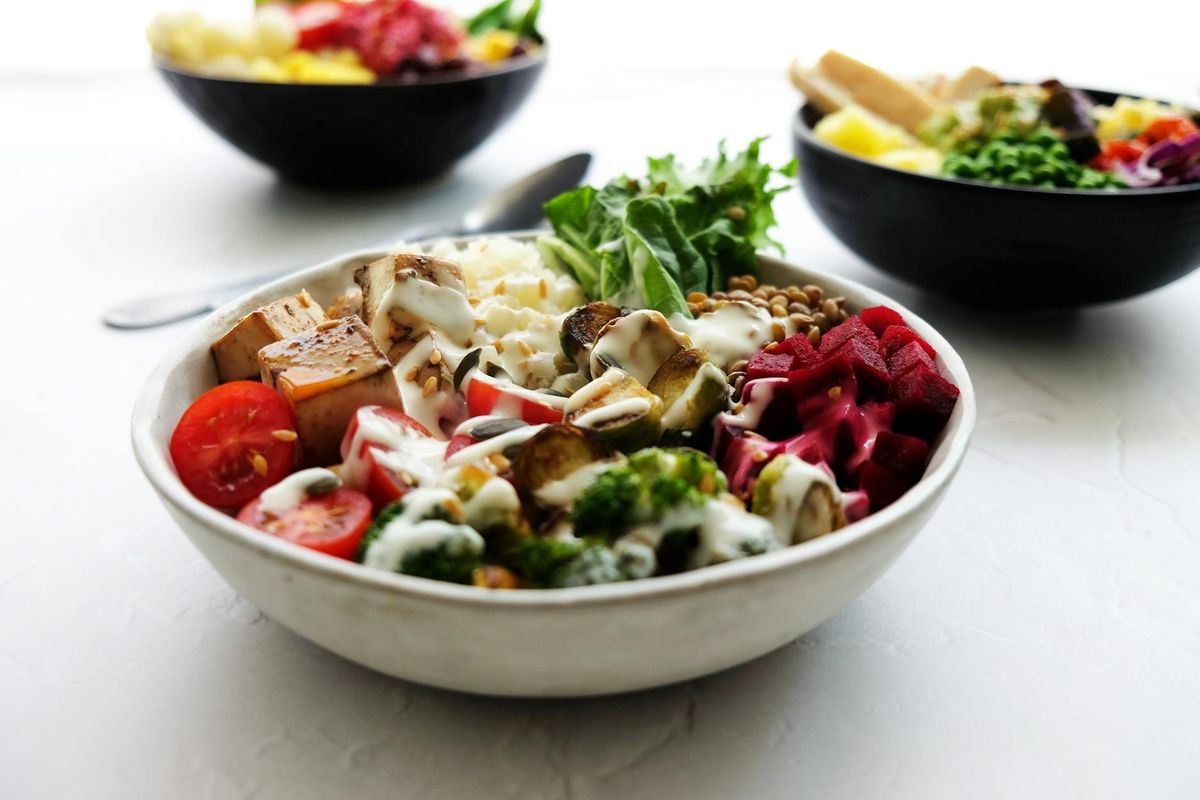 Vibrant vegan Buddha bowl filled with fresh vegetables and healthy ingredients.