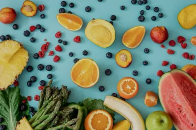 A bowl filled with fresh fruits and greens